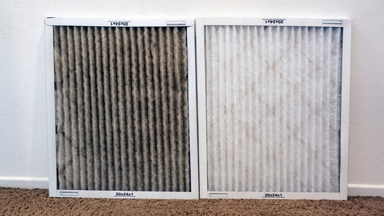 A side-by-side comparison of a dirty and clean HVAC air filter