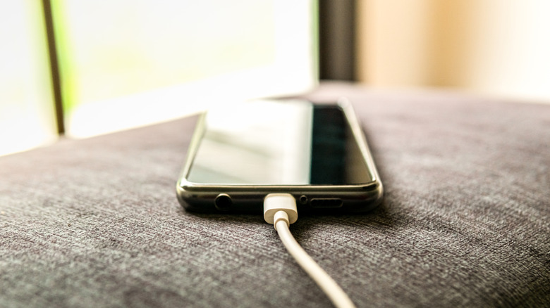 Charging cable plugged into a phone.