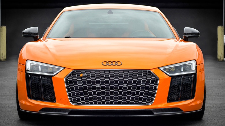 Front shot of an orange Audi R8.