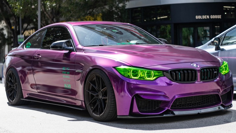 BMW M4 with gloss grape vinyl wrap