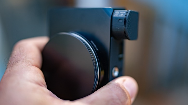 View of the Sigma BF with the body cap attached and the battery partly ejected.