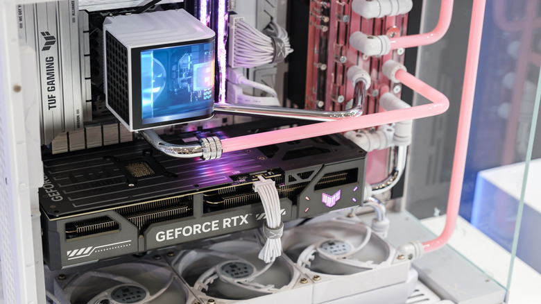 The inside of a PC case with a custom loop liquid cooler