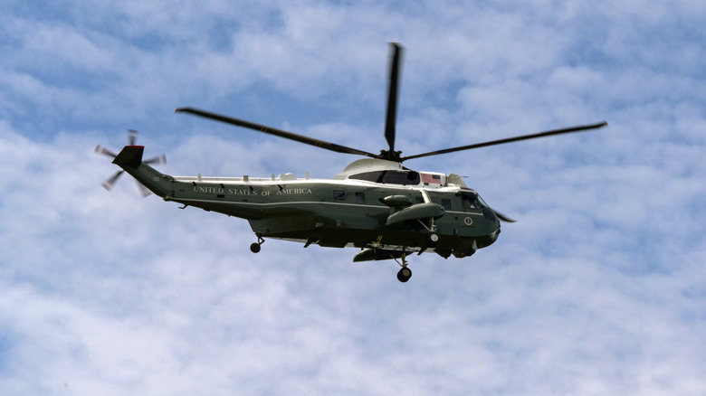 A United States government Sikorsky Sea King shown in profile in flight