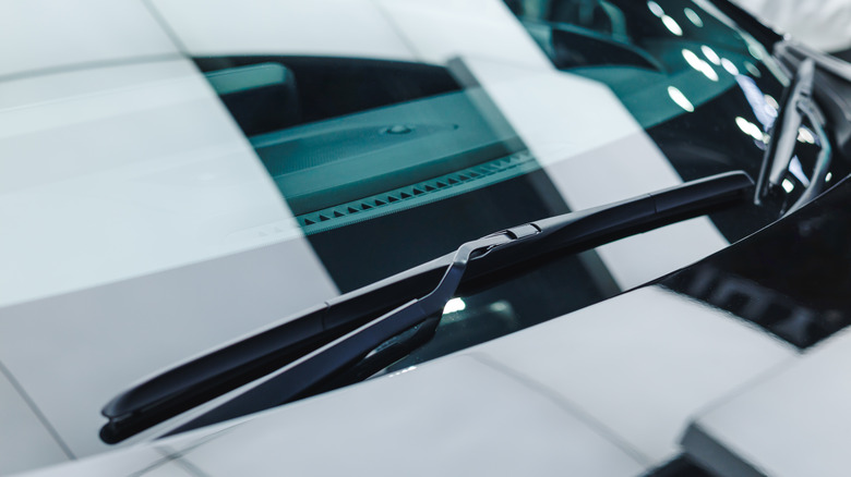 A close-up shot of a modern car with two wiper blades tucked in.
