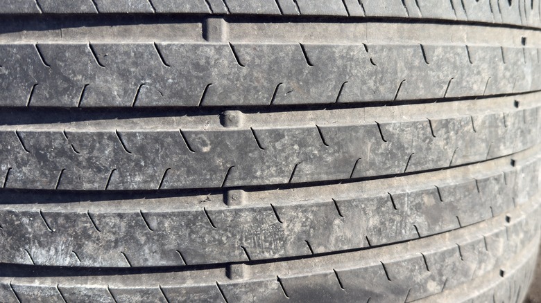 Worn-out tire with damaged treads