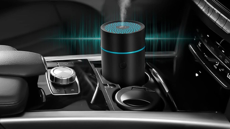 The NEXHC Car Fragrance Diffuser puffs diffuses mist from cupholder