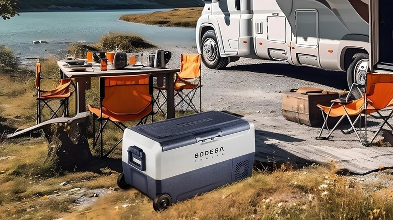 The BODEGA Cooler 38 Car Fridge at a campsite near a lake