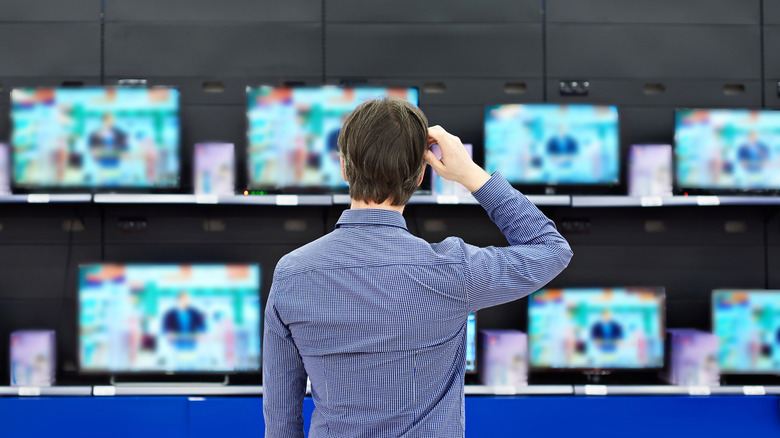 Person looking at TVs in a store