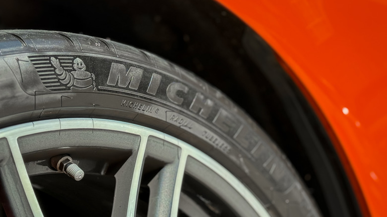 Close-up of Michelin tire on orange car