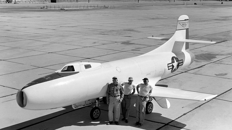 Three pilots pose with NASA Skystreak