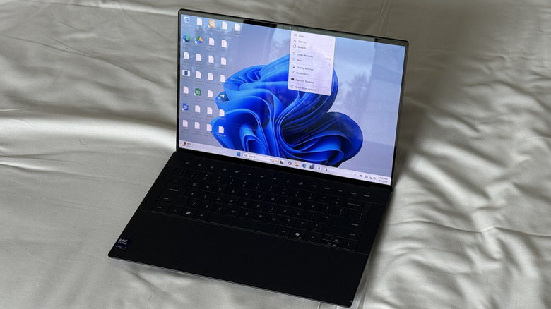 Dell Premium 14 on a bed
