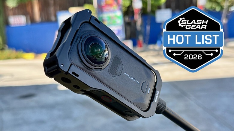 The Insta360 X6 on a long monopod.