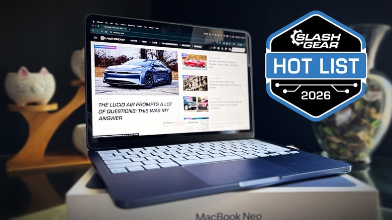 A picture of a MacBook Neo sitting on top of the retail box