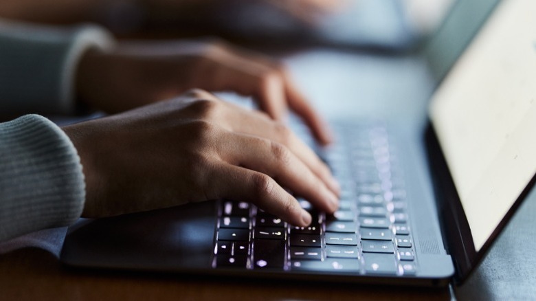 Person typing on a laptop