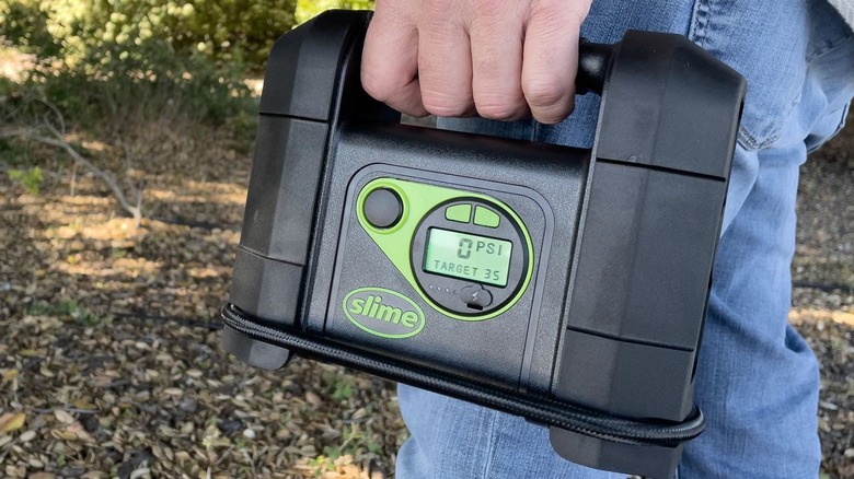 Man with Slime cordless inflator