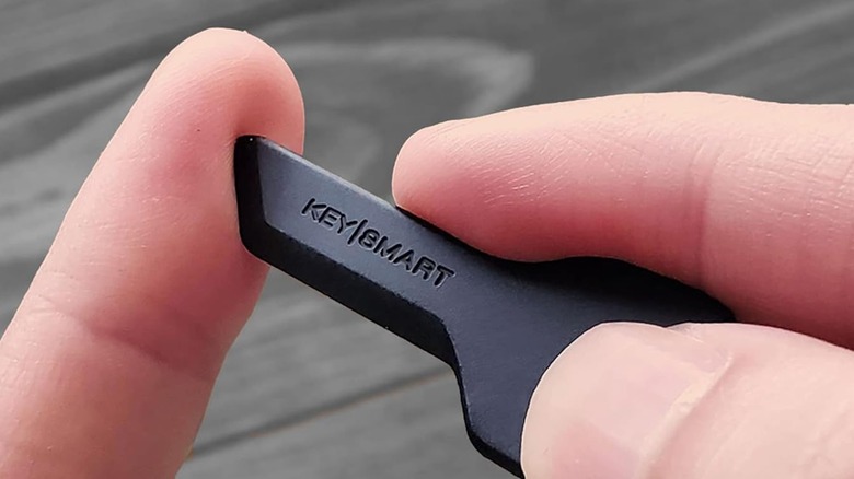 Hands holding a KeySmart Safe Box Cutter.