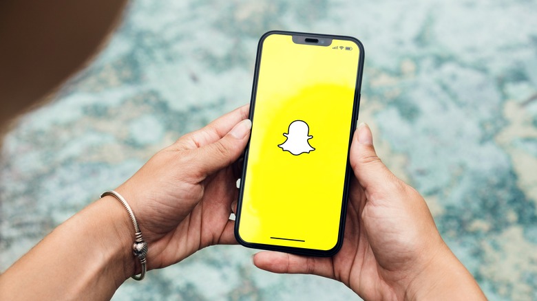 Snapchat logo on a smartphone