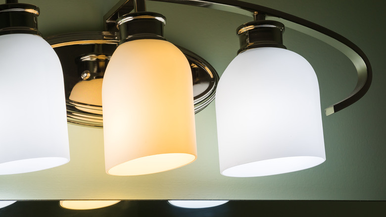 soft white vs daylight lamps suspended off a ceiling