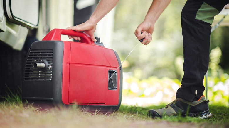 person revving a generator