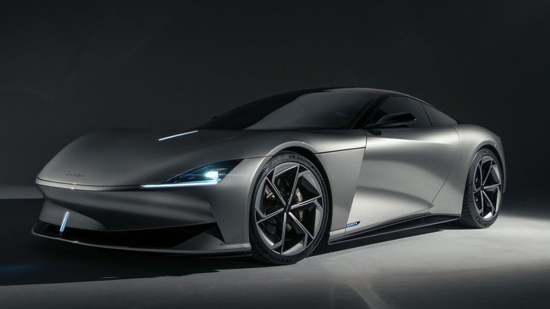 Karma Kaveya studio photo on gray background, front-left 3/4 view