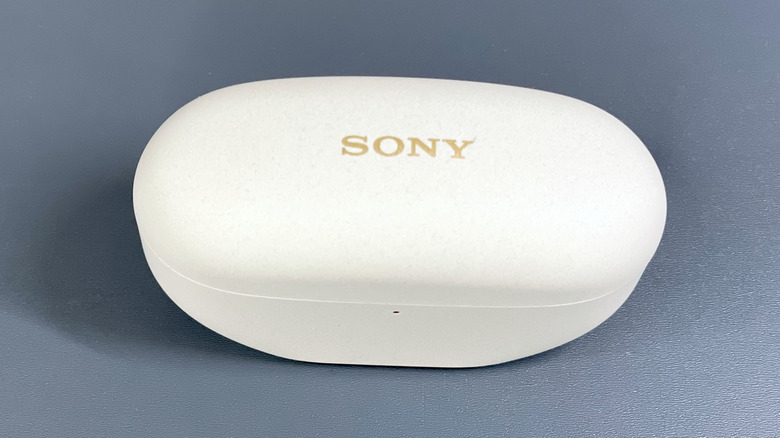 Outside of WF-1000XM5 charging case, closed, from a top view showing "Sony" logo