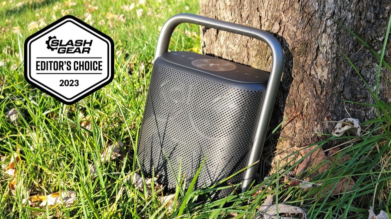 Soundcore X500 by tree in grass