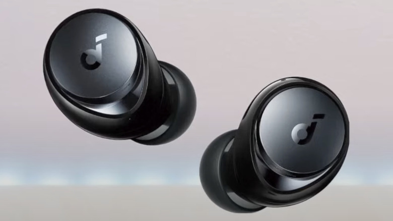 The Soundcore Space A40 earbuds suspended in the air.