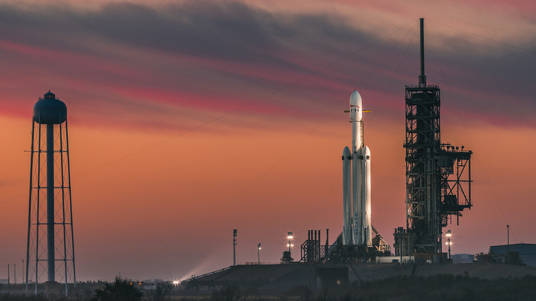 A SpaceX Falcon Heavy rocket on the launch pad.