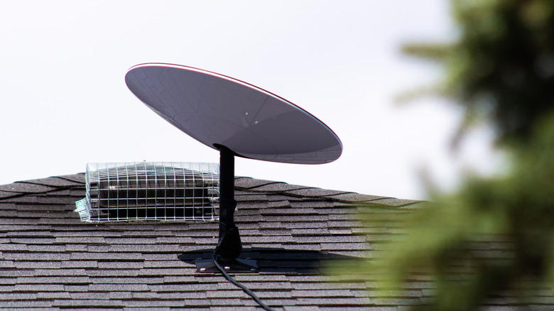 Starlink antenna atop a rooftop.