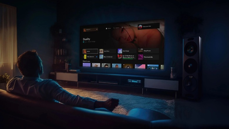 Person using Spotify app on a TV.