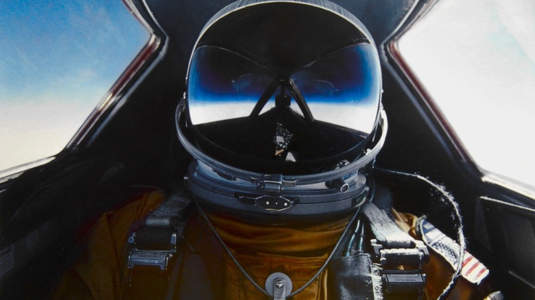 A self-portrait of Brian Shul in full flight suit gear in SR-71 Blackbird cockpit