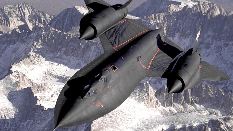 The SR-71B Blackbird flying over snowy mountains