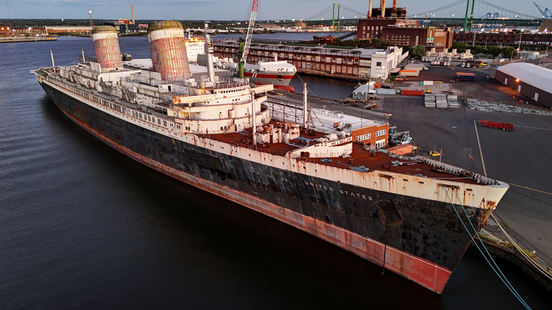 Aerial view of SS United States ship tied up at dock in Philadelphia.