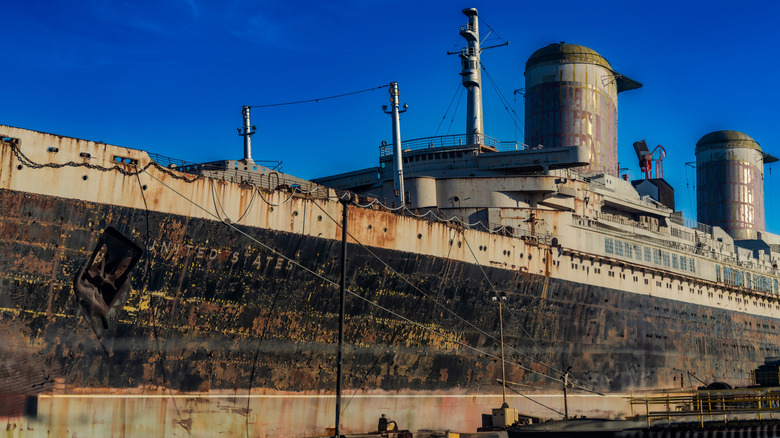 Front view of SS United States ocean liner showing a rust and deterioration.