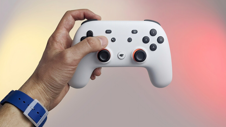 Man holds Stadia controller