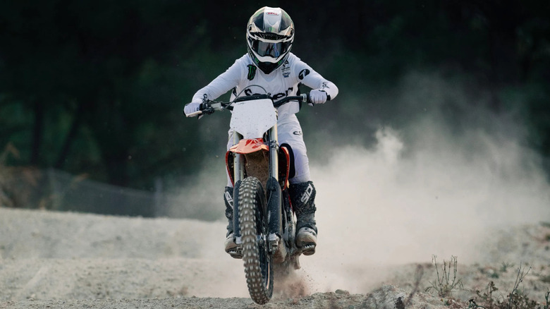 Man riding Stark Varg motorcycle at speed