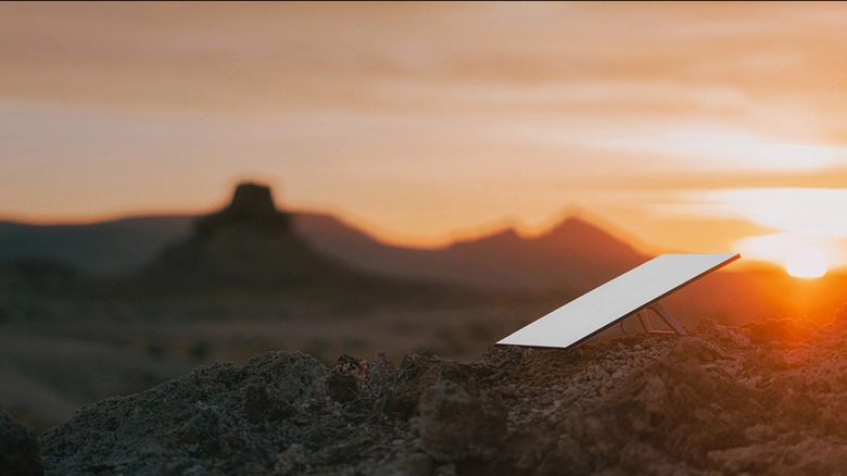 Starlink dish pictured against a sunset