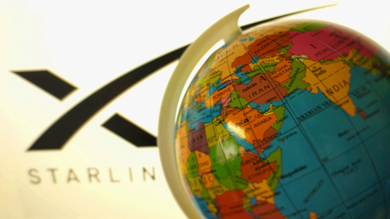 The Starlink logo with a colorful globe sitting in front