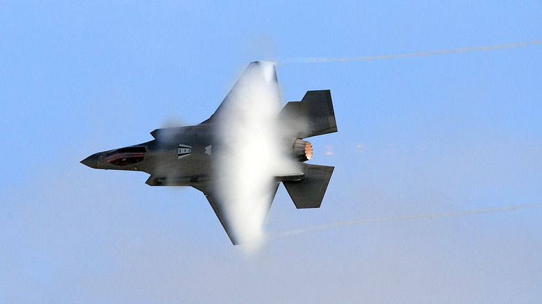 F-35 Lightning II with vapor contrails