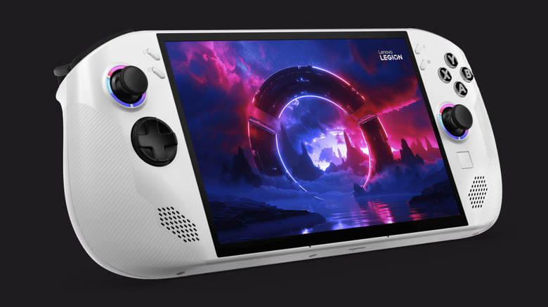 A white Lenovo Legion Go S at a 3/4 angle showing a glowing pink and purple display, plus LED joysticks and black buttons.