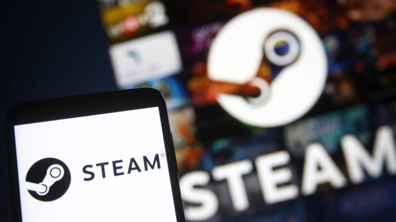 Steam logo on screen and smartphone