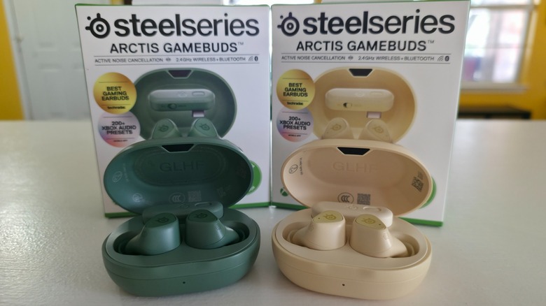 Two versions of the SteelSeries Arctis GameBuds side by side with their boxes