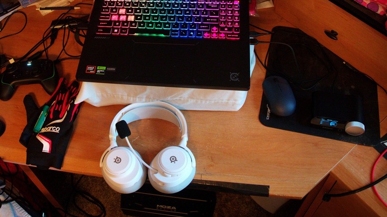 SteelSeries Arctis Nova Pro Omni gaming headset on a gaming desk.