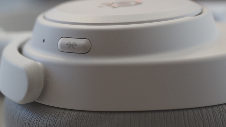 Close-up view of SteelSeries Arctis Nova Pro Omni right ear cup with Bluetooth button