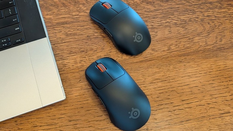 SteelSeries Rival Pro and Sensei Pro mice next to an open laptop