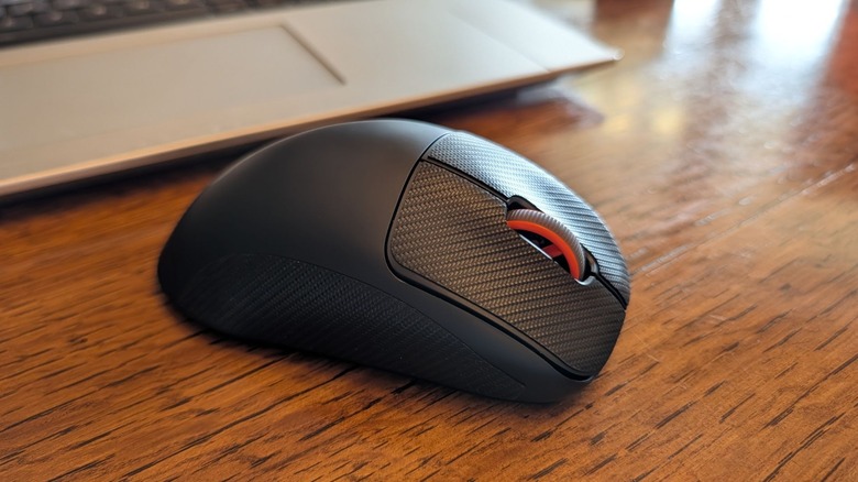 Closeup of scroll wheel and grip stickers on SteelSeries Rival Pro mouse