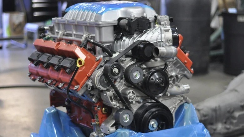 A Hellcat crate engine being unwrapped