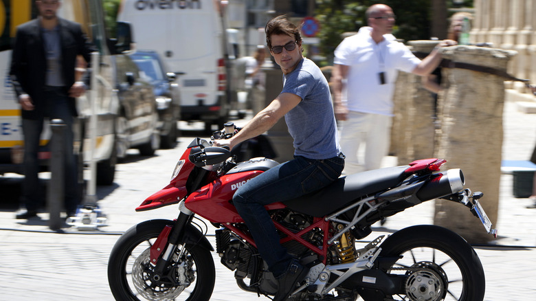 Tom Cruise riding a motorcycle