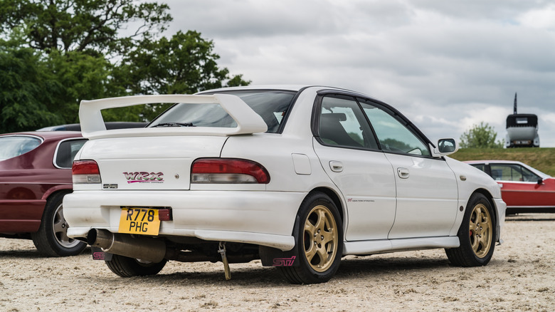 A white Subaru Impreza Turbo is displayed at the Chester Classic Car Auction.