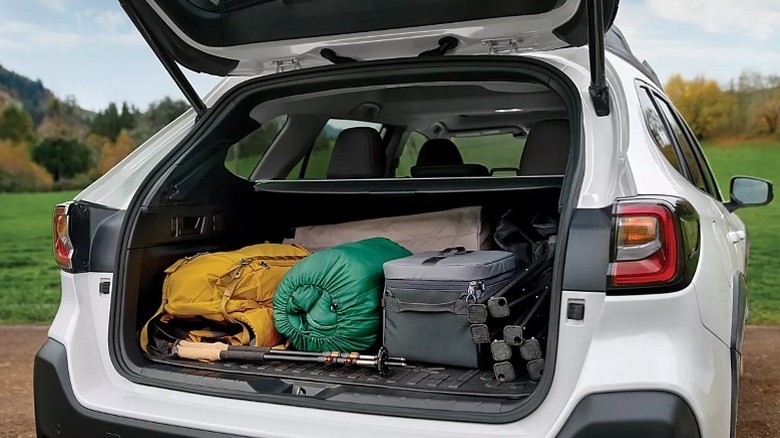 Daytime shot showing the open rear cargo area of a Subaru Outback